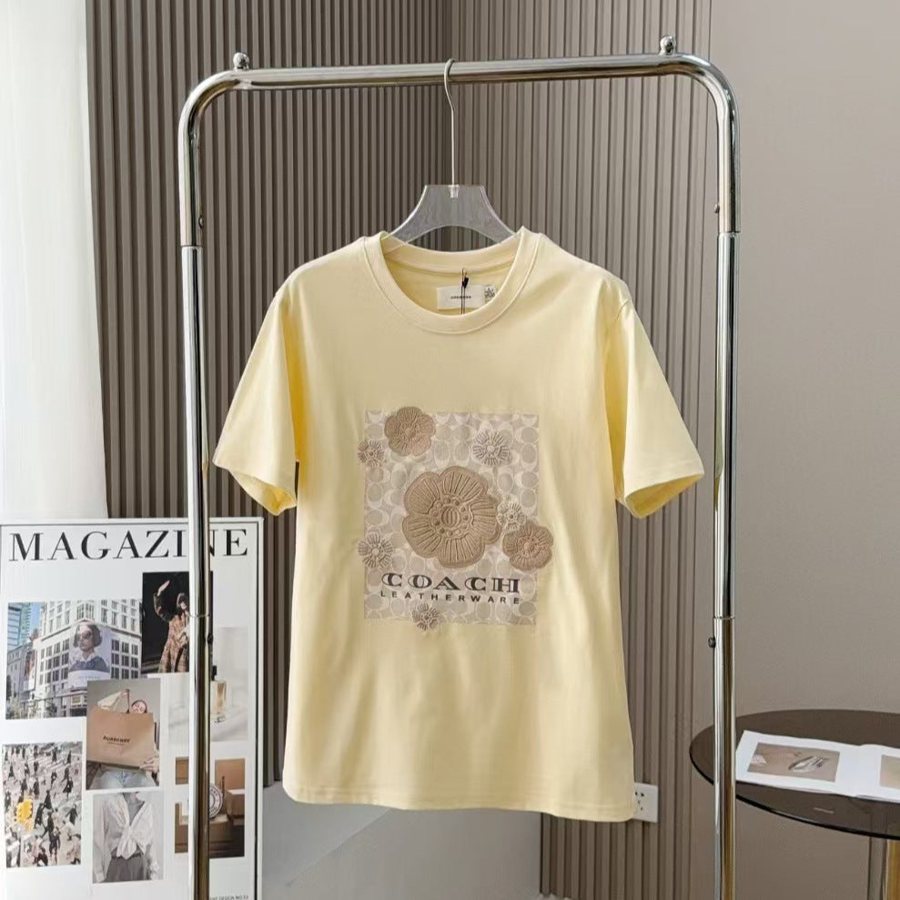 Coach Damen atmungsaktives, trendiges T-Shirt mit Blumenmuster