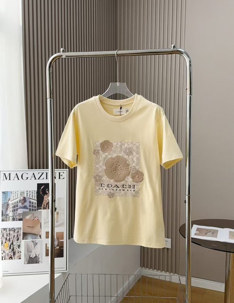 Coach Damen atmungsaktives, trendiges T-Shirt mit Blumenmuster