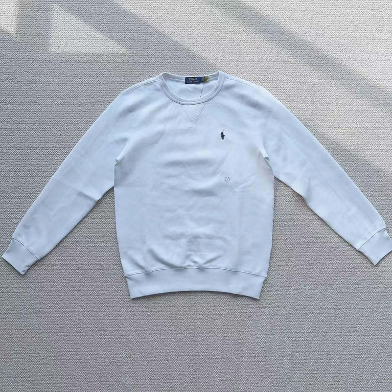 White Polo Ralph Lauren crew neck sweatshirt laid flat on a white surface