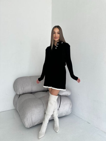 Woman in a black Casual Knitted Sweater and Skirt Two-Piece Set at volonka store.