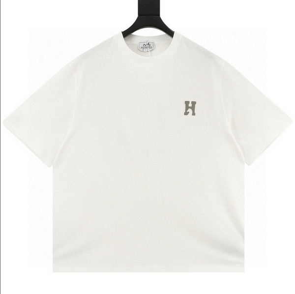 Hermes Genuine Leather H Cheval Tshirt displayed on a hanger in white color with a prominent 'H' logo.