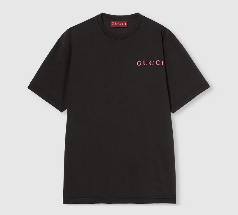 Black Gucci t-shirt with pink logo on a light gray background