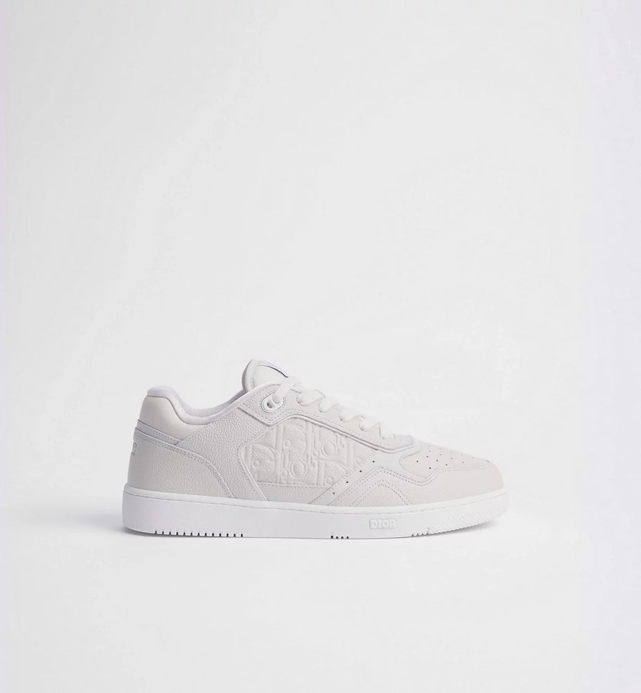 Dior B27 Uptown Low Top Leder Sneaker White side view on a plain background.