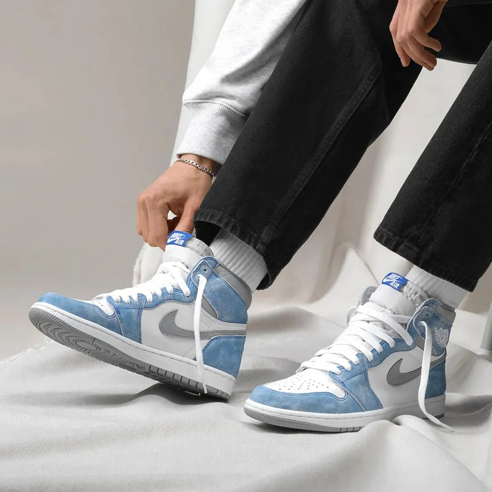 Nike Jordan 1 High OG Hyper Royal side view showcasing iconic design and blue hues. Nike Jordan 1 High OG Hyper Royal side view showcasing iconic design and blue hues at Volonka