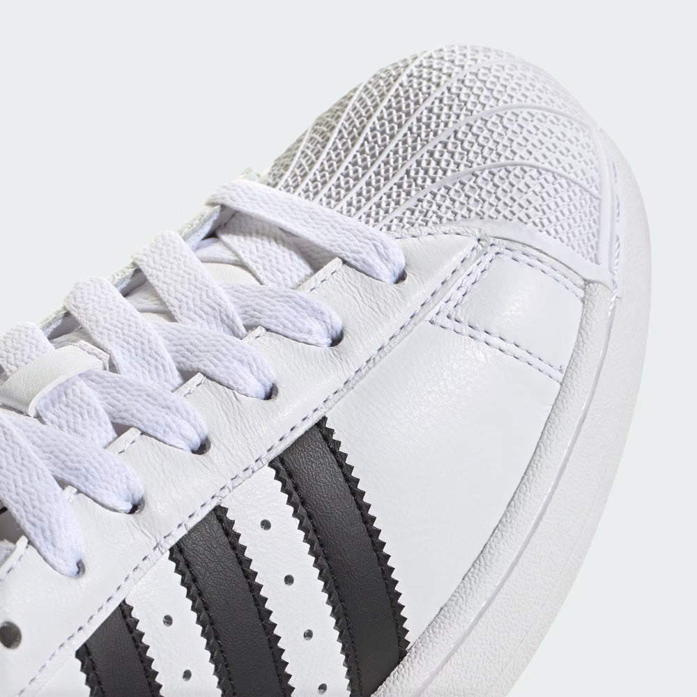 Adidas Superstar II Sneaker white side view with black stripes and rubber shell toe at Volonka.