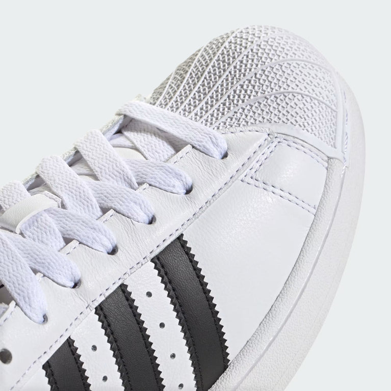 Adidas Superstar II Sneaker white side view with black stripes and rubber shell toe at Volonka.