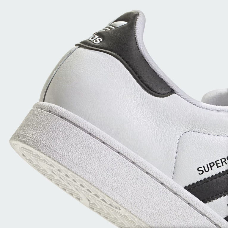 Adidas Superstar II Sneaker white side view with black stripes and rubber shell toe at Volonka.