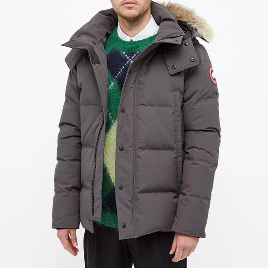 Canada Goose Wyndham Parka Goose Men's Winter Jacket at Volonka. Man wearing a gray puffer jacket.
