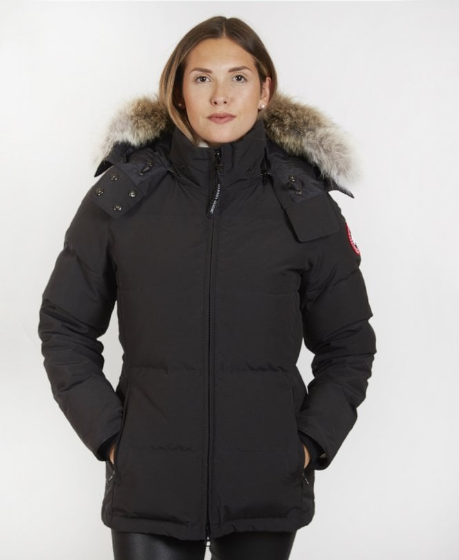 Woman wearing a black winter coat with fur-lined hood, Canada Goose Chelsea Parka Women's Down Winter Jacket