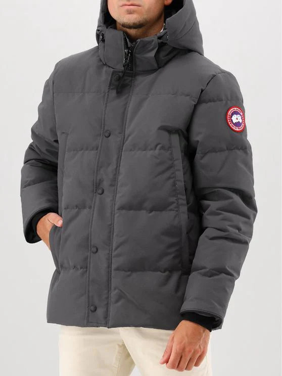 Man wearing a gray Canada Goose jacket, Canada Goose Wyndham Parka Goose Men's Winter Jacket at Volonka. 