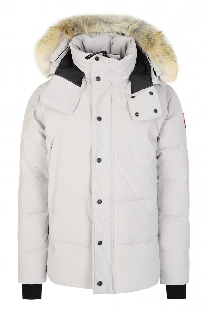 White winter coat with fur-lined hood on a white background. Women's/ men Canada Goose Wyndham Parka with Fur jacket