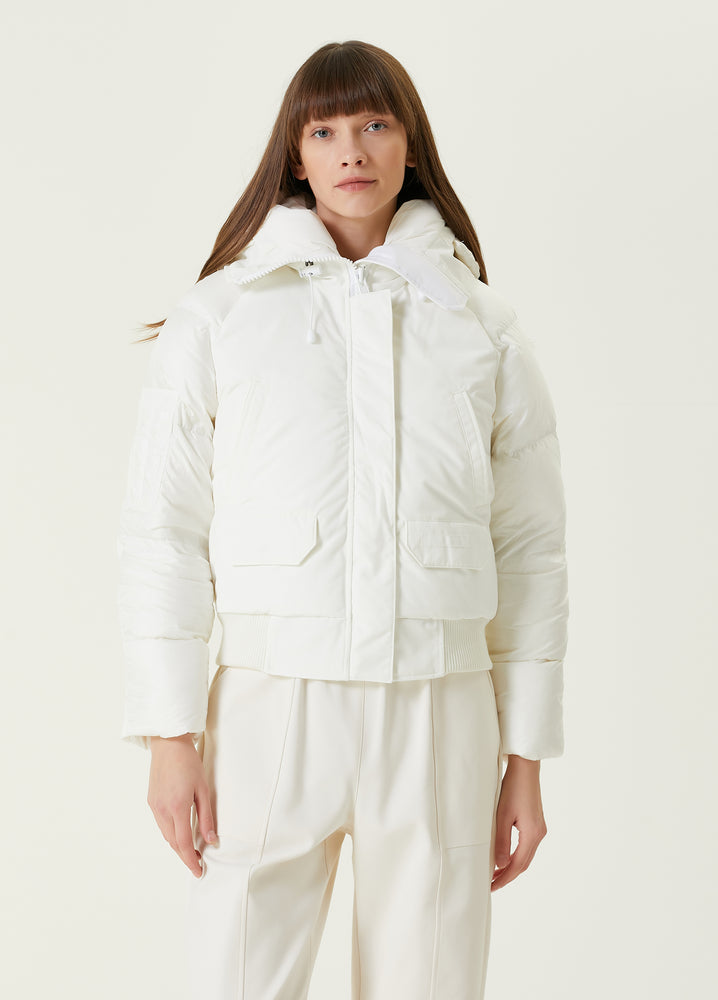 Woman wearing a white puffer jacket and pants, Canada Goose Paradigm Chilliwack Bomber Unisex Down Jacket at Volonka store.