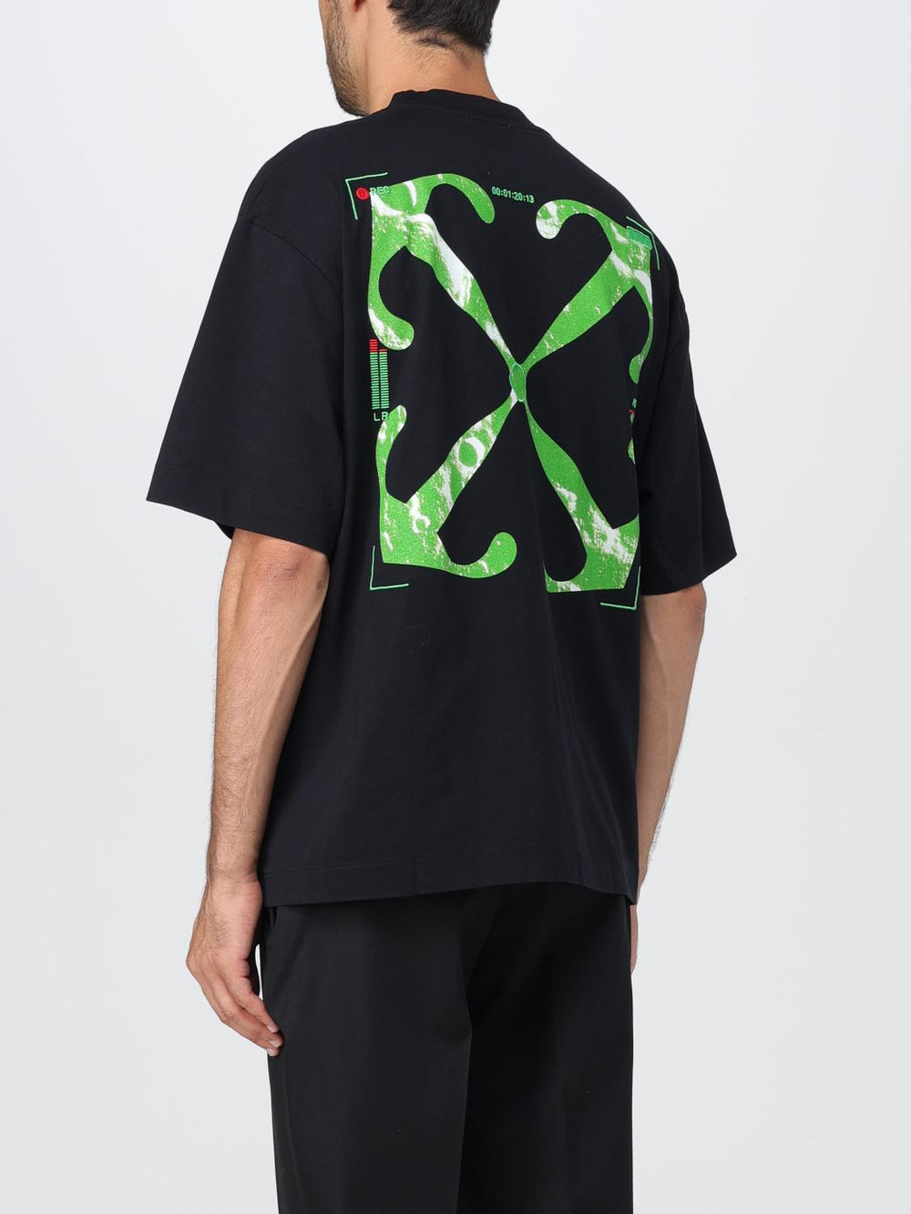 Off White Moon Cam Arrow Tshirt featuring a bold green graphic on a black backg