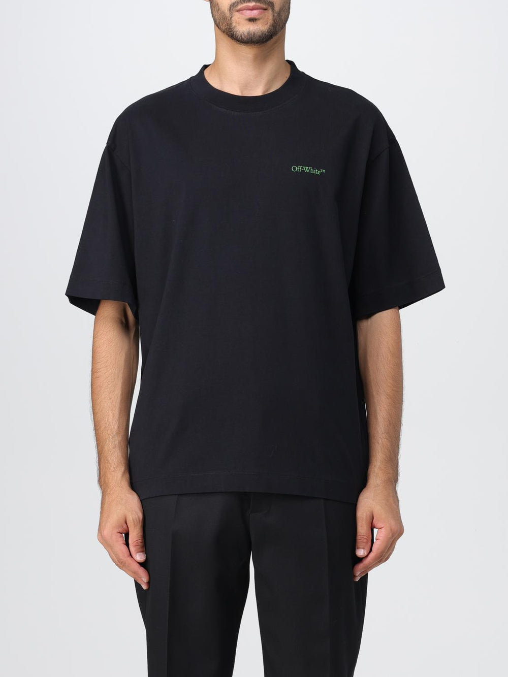 Off White Moon Cam Arrow Tshirt featuring a bold green graphic on a black backg