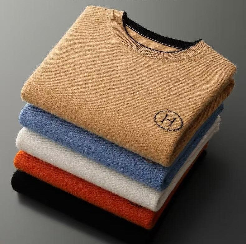 Stack of Hermes Men's Cashmere Knitwear Luxury Warm Sweater in various colors, showcasing soft, elegant fabric.