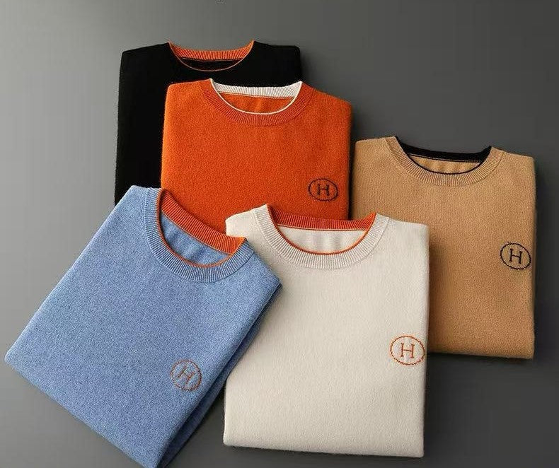 Stack of Hermes Men's Cashmere Knitwear Luxury Warm Sweater in various colors, showcasing soft, elegant fabric.