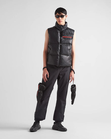 Prada Men's light Down Vest jacket, man wearing a black puffer vest and pants on a white background
