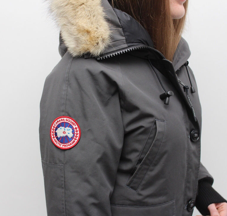 Gray parka with fur hood and Canada Goose logo on a white background. Canada Goose Chilliwack Bomber Women's Winter Hooded Jacket in volonka store