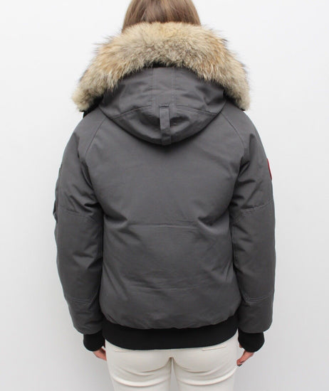Gray winter jacket with fur hood on a white background. Canada Goose Chilliwack Bomber Women's Winter Hooded Jacket