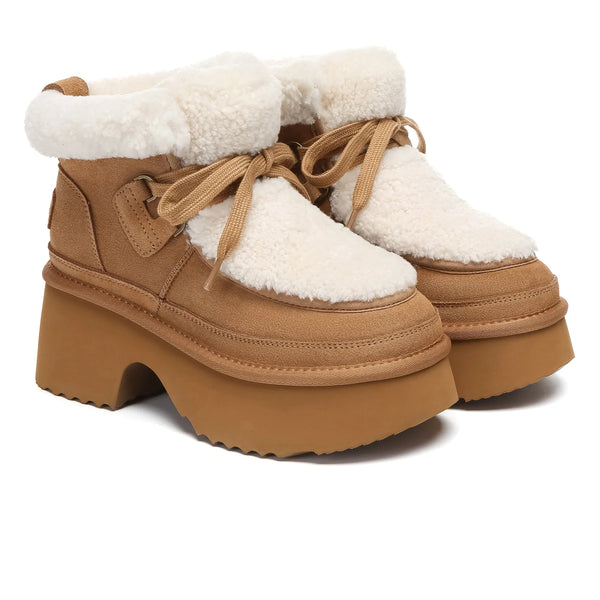 UGG Platform Lace-Up Shearling Upper Boots at Volonka. Pair of brown platform boots with white fur lining on a white background