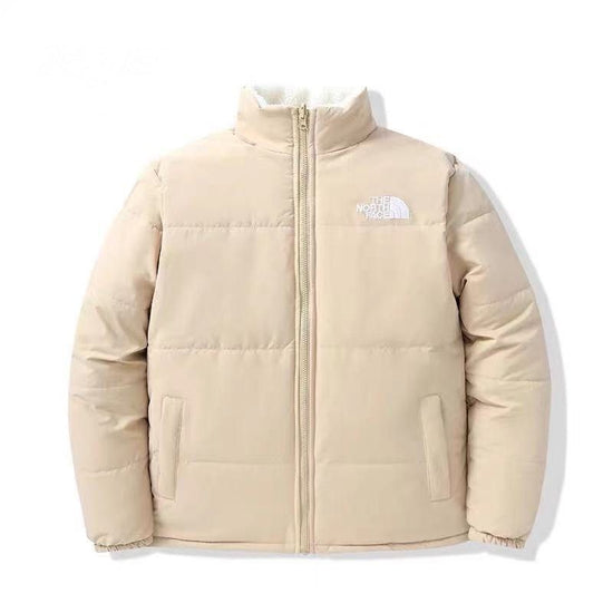 The NorthFace Two Sided Coat for Women and Men. Beige puffer jacket with brand logo on a white background