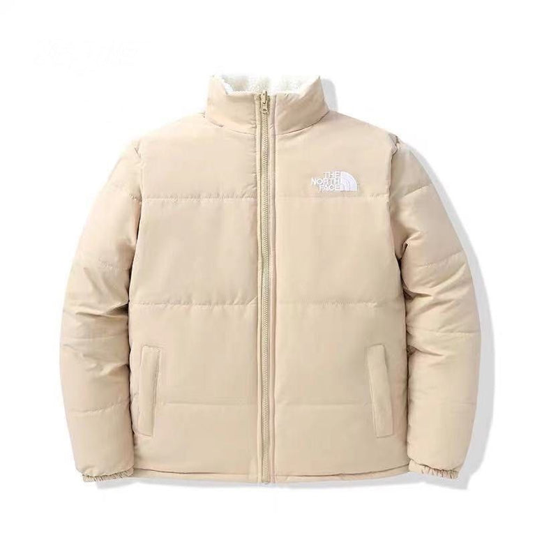 The NorthFace Two Sided Coat for Women and Men. Beige puffer jacket with brand logo on a white background
